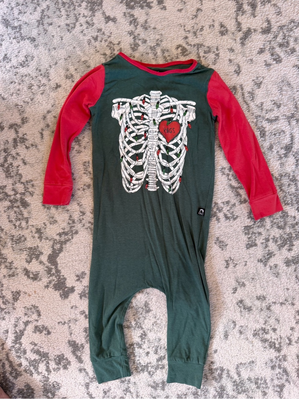 Rags to Raches Dark Green One-Piece with Red Long Sleeves and Skeleton Print